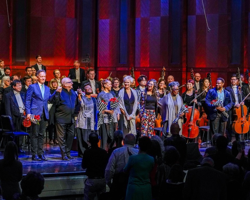 orchestra, conductor, composer, librettist, and dancers on stage taking bow
