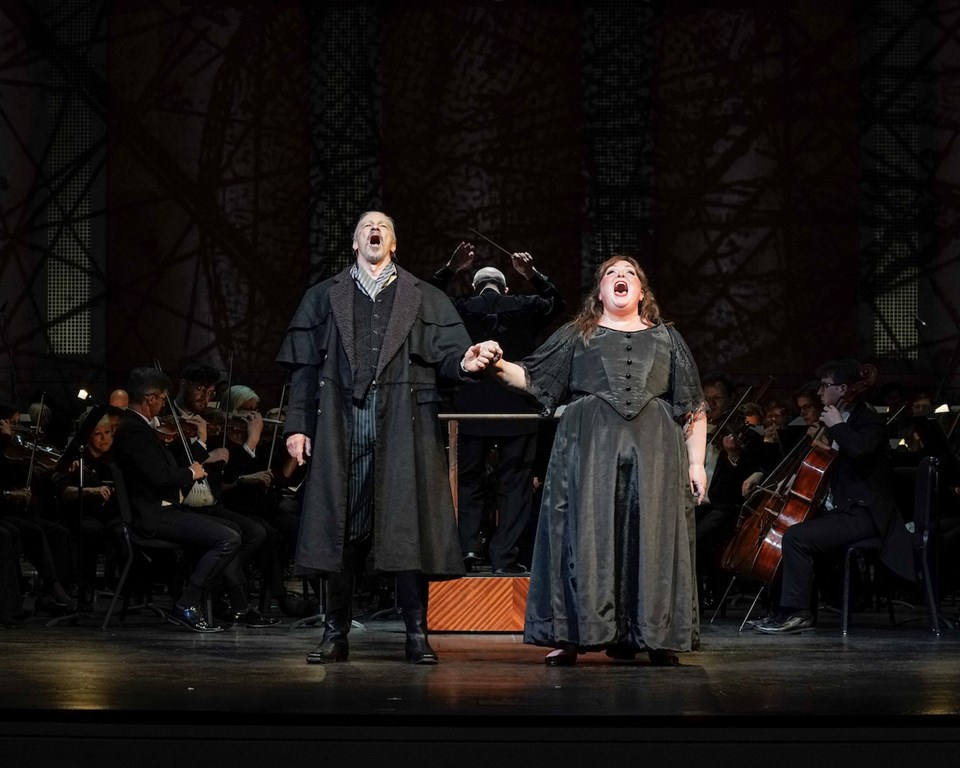 Male and female opera singer singing and holding hands