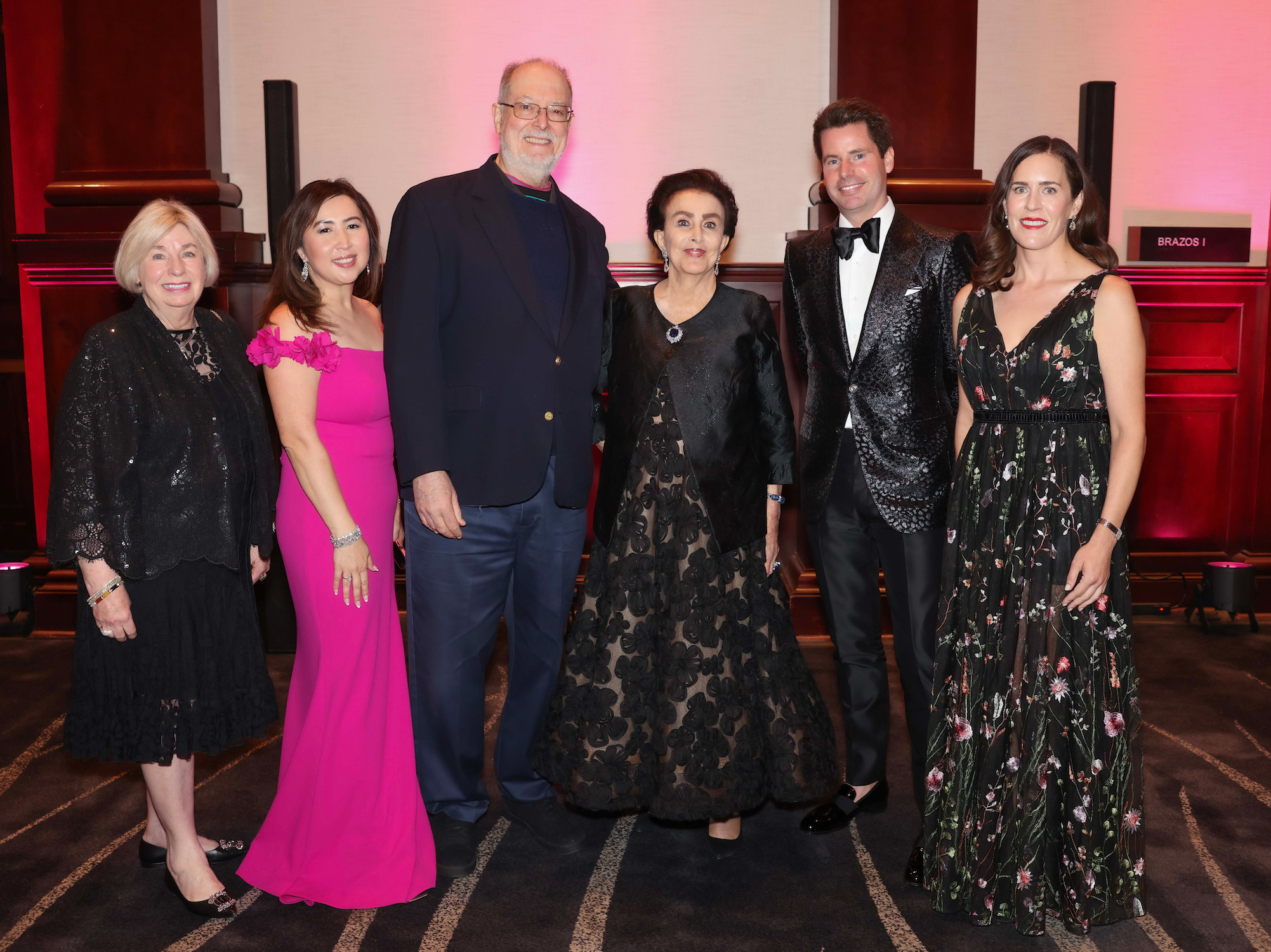 Six people in formal wear at Gala