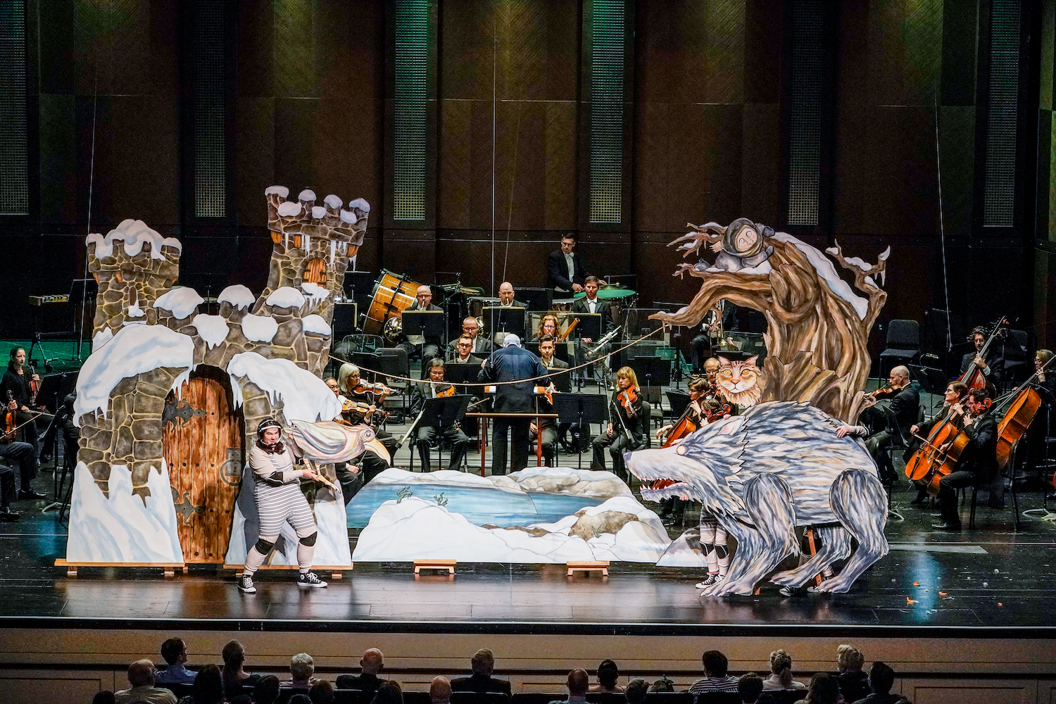 Peter and the Wolf puppets on stage in front of orchestra