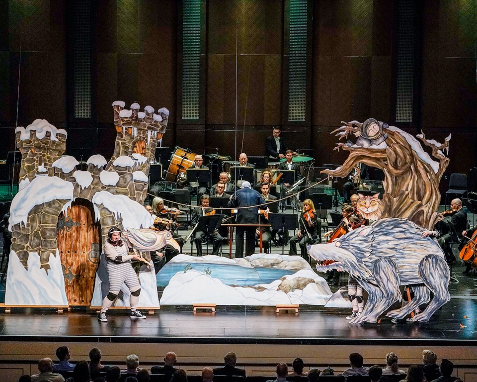 Peter and the Wolf puppets on stage in front of orchestra